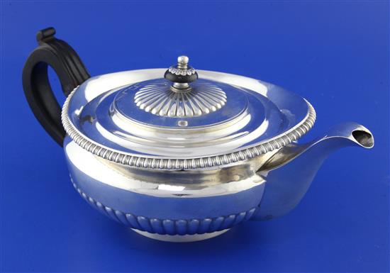 A George III demi-fluted silver teapot, gross 22 oz.